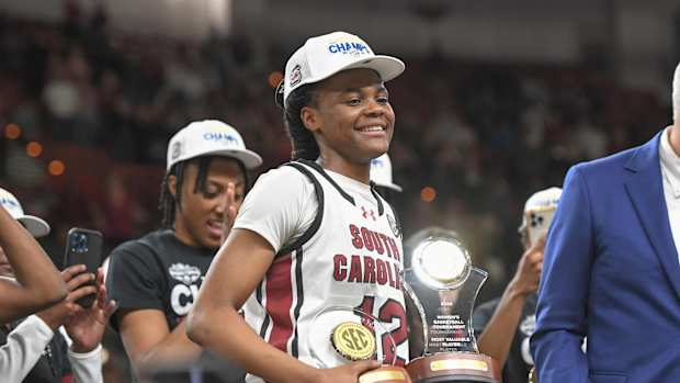 South Carolina guard MiLaysia Fulwiley (12) holds the MVP trophy after South Carolina beat LSU for the SEC Women's Basketball Tournament Championship at the Bon Secours Wellness Arena in Greenville, S.C. Sunday, March 10, 2024.